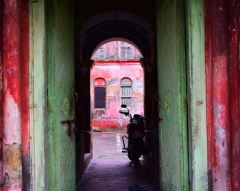 Rear view of people in old building