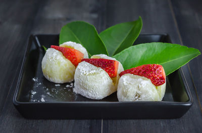 Close-up of strawberries in plate on table