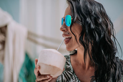 Portrait of happy woman holding ice cream