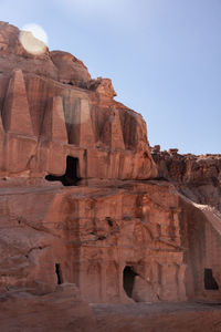 Low angle view of rock formation against clear sky