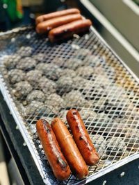 High angle view of sausages on barbecue grill