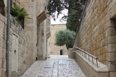 Alley amidst buildings in city