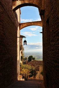 View of historic building seen through arch window