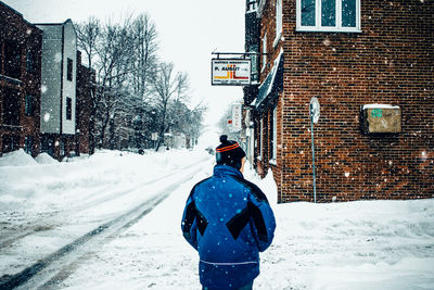 Man with umbrella on snow