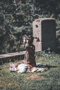 Rear view of woman standing in park