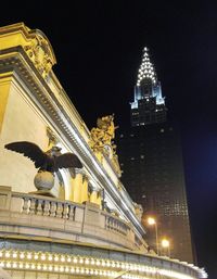 Low angle view of illuminated building at night