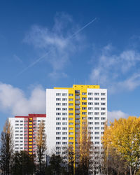 Low angle view of buildings against blue sky
