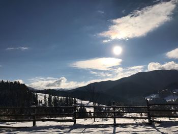 Scenic view of mountains against sky during winter