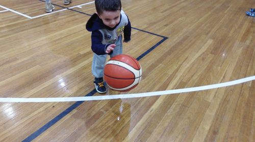High angle view of man playing with ball
