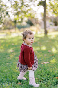 Portrait of girl standing on field