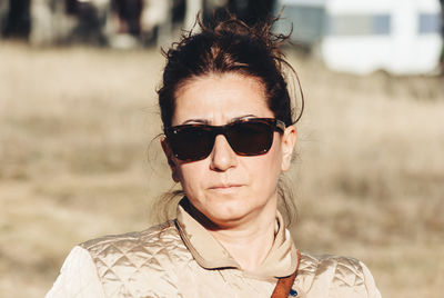 Close-up portrait of mature woman wearing sunglasses