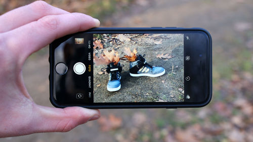 Close-up of hand holding camera