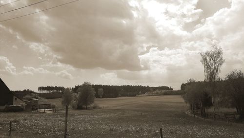Panoramic shot of field against sky