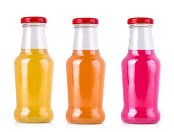 Close-up of bottles against white background