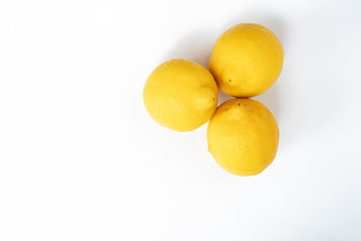 High angle view of oranges against white background