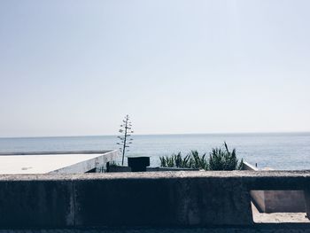 Scenic view of beach against clear sky