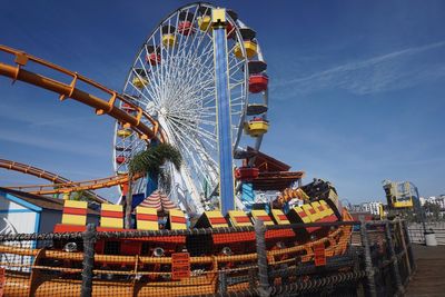 Ferris wheel against sky at amusement park