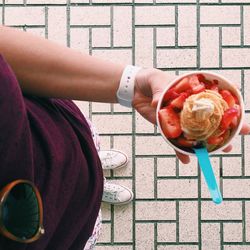 Cropped image of person eating food