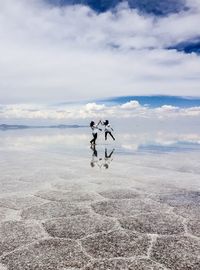 Scenic view of sea against cloudy sky