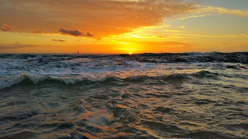 Scenic view of sea at sunset