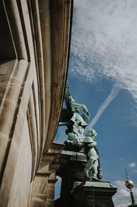 Low angle view of statue against building
