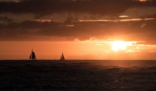 Scenic view of sea against orange sky