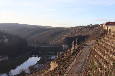 High angle view of bridge over river in city against sky