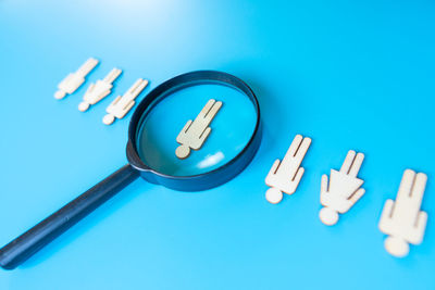 Directly above shot of key on blue background