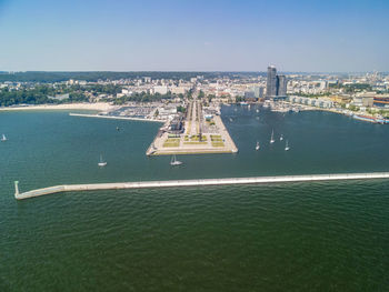 High angle view of buildings by sea against sky, aerial view on the port in gdynia, poland
