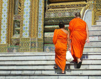 Rear view of men on temple against building