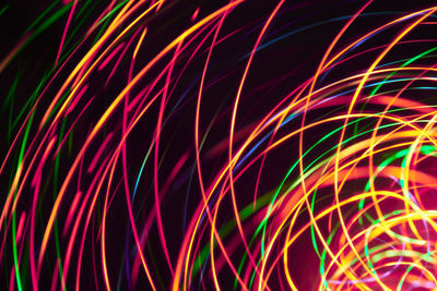 Close-up of light trails against black background