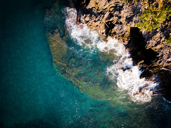 High angle view of rock formation in sea