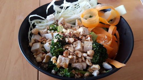 High angle view of chopped vegetables in bowl on table