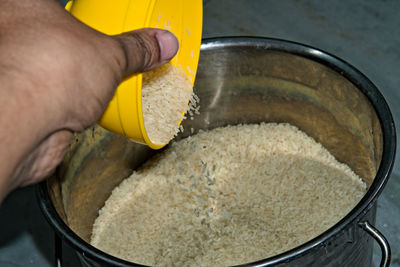 Cropped hand of person preparing food