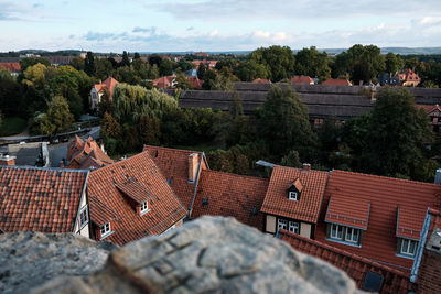 High angle view of buildings in town against sky