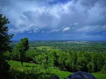 Scenic view of landscape against cloudy sky