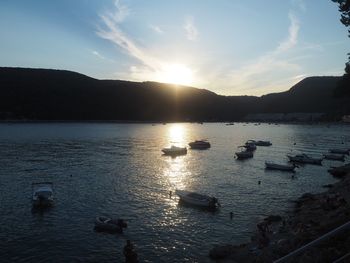 Scenic view of lake against sky during sunset