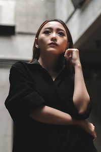 Portrait of a young woman looking away