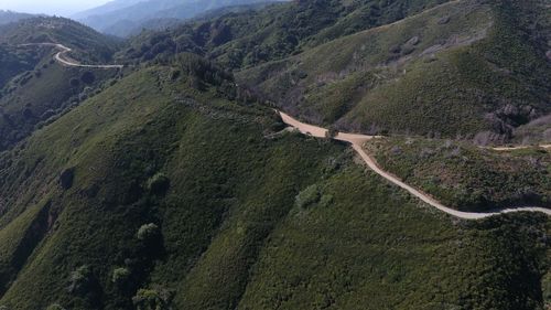 High angle view of road amidst mountains