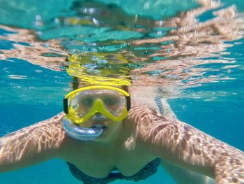 Portrait of woman swimming in sea