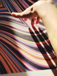 Cropped hand of woman holding fabric