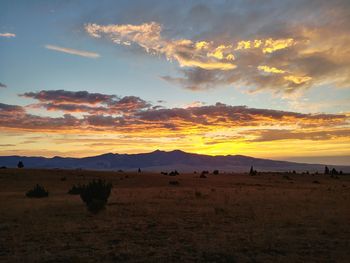Scenic view of landscape against sky during sunset