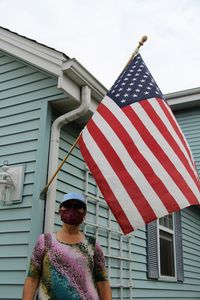 Low angle view of woman admiring united states flag