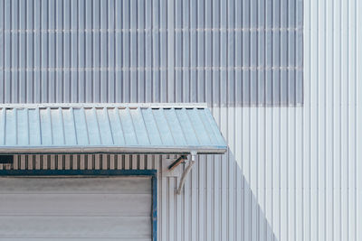 Detail view of canopy construction on white wall