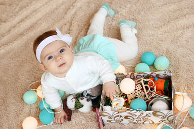 Portrait of cute baby with toy