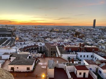 High angle view of seville against sky during sunset