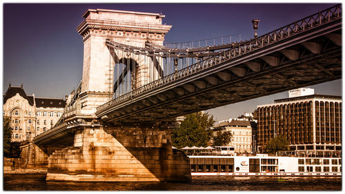 View of bridge against sky in city