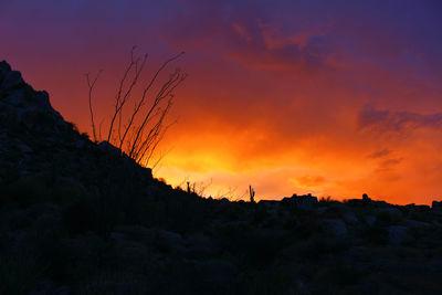 View of desert against orange sky