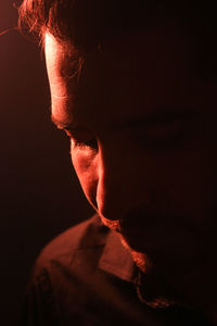 Close-up of man in dark