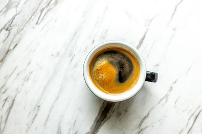 High angle view of coffee cup on table